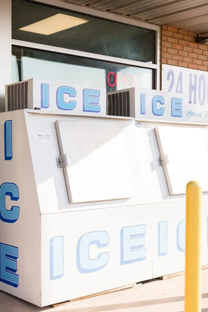 A white box with blue letters that says ice on it