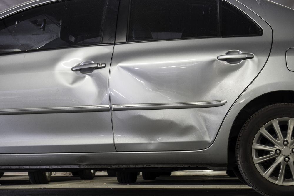 Grey Car Wrecked — Hillside Auto Dismantlers in Byron Bay, NSW