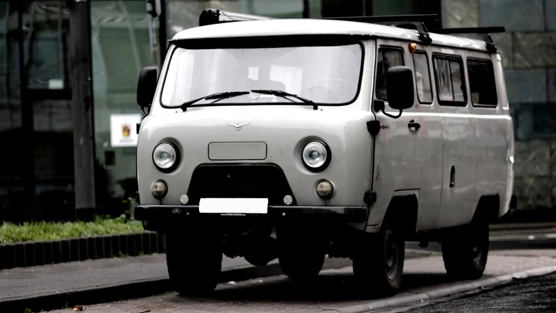 An Vintage Car Removing White Car — Hillside Auto Dismantlers in Casino, NSW