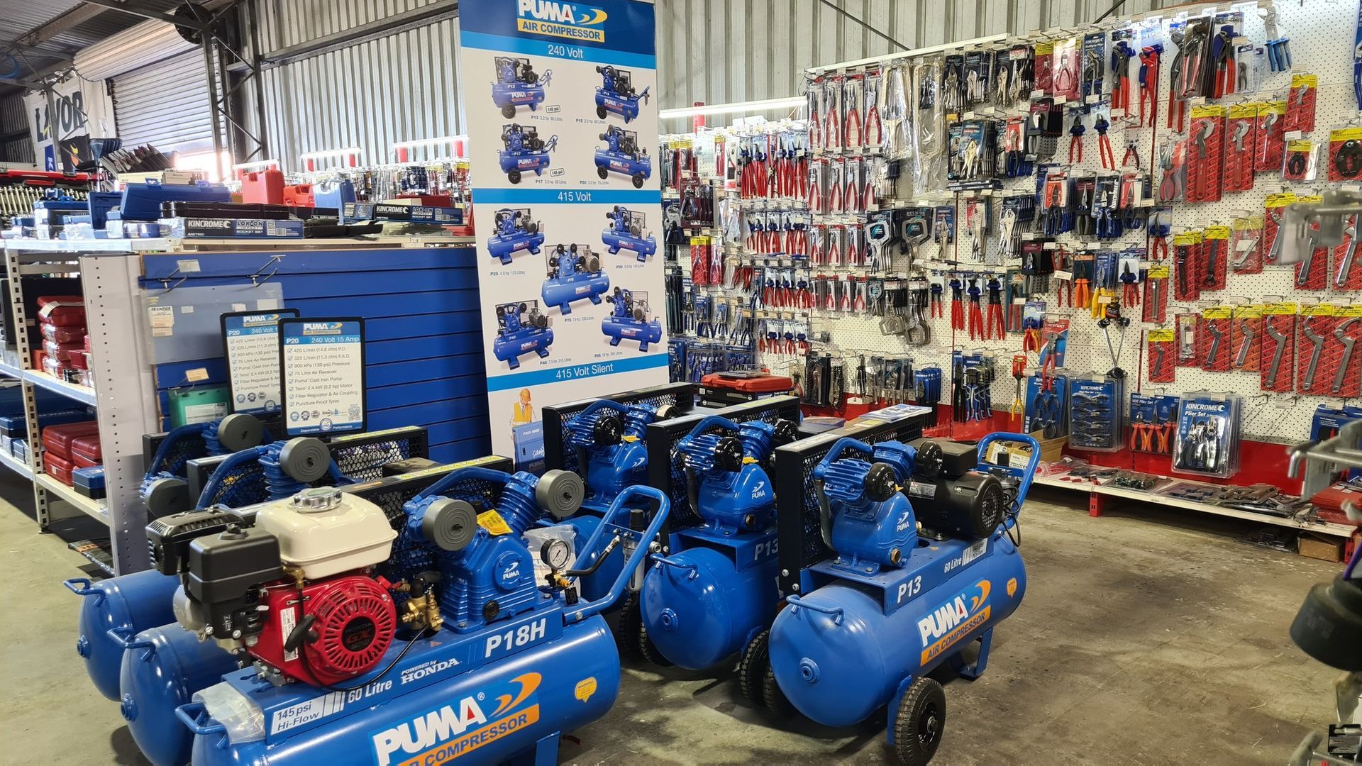 A store filled with lots of tools and air compressors.