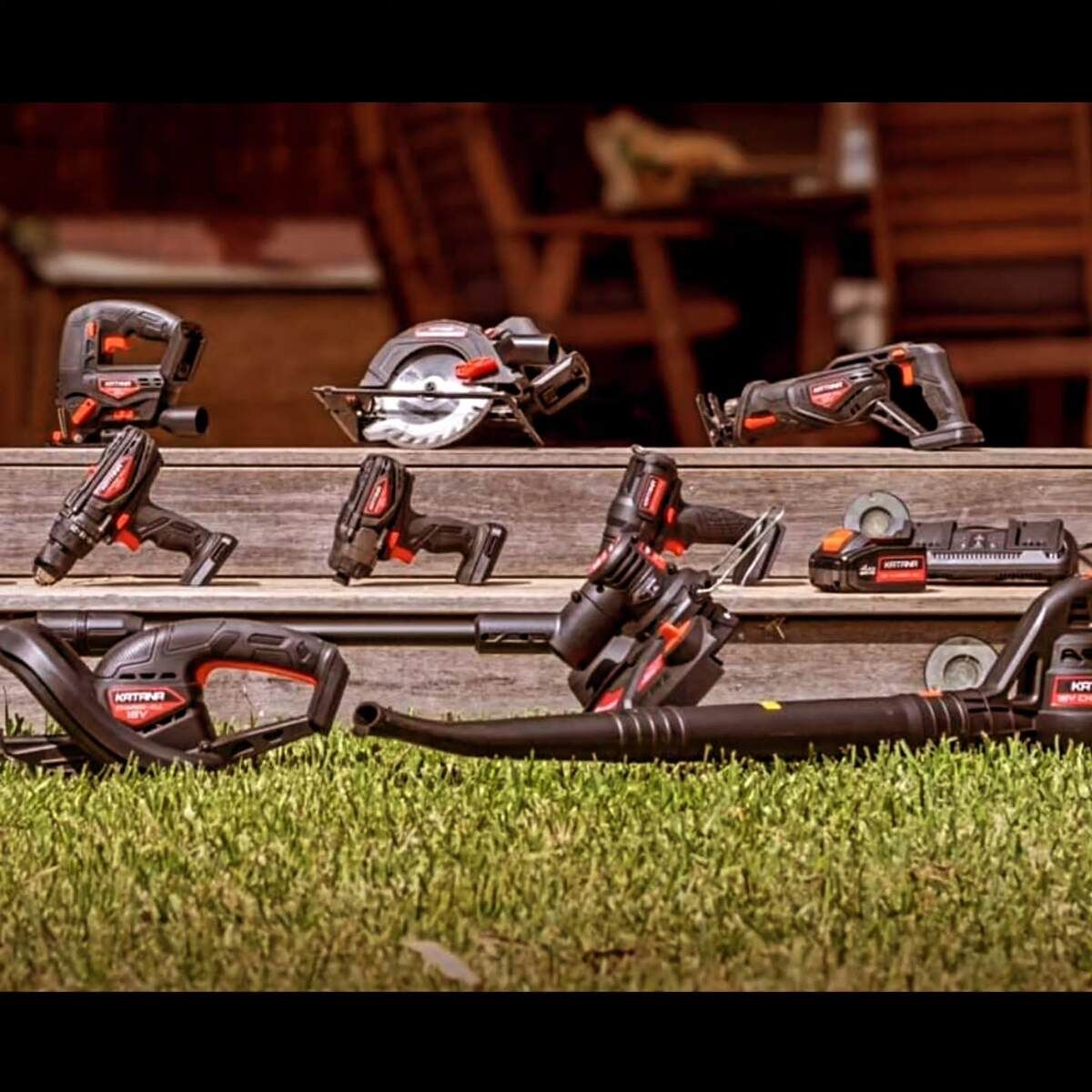 A Bunch Of Tools Are Sitting On A Wooden Shelf In The Grass — Summerland Tool Supplies In Casino, NSW