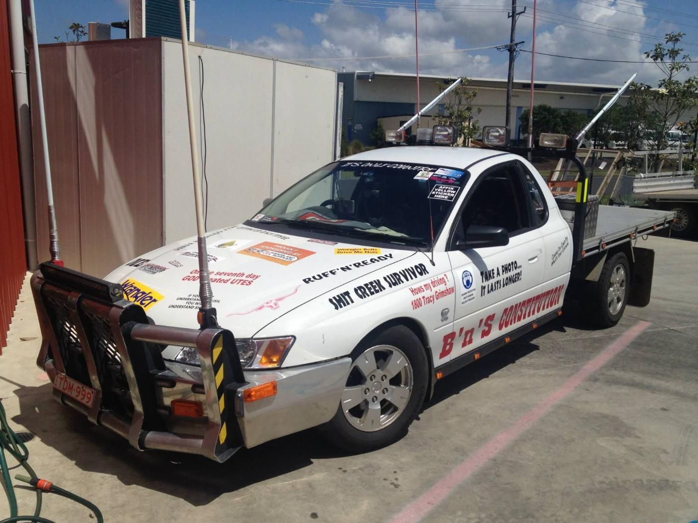 A White Truck With a Flat Bed is Parked in a Parking Lot  — Summerland Tool Supplies In Casino, NSW