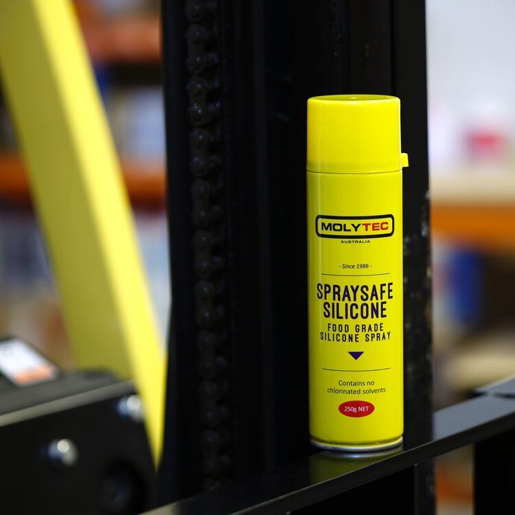 A Can of Spraysafe Silicone is Sitting on a Railing— Summerland Tool Supplies in Casino, NSW