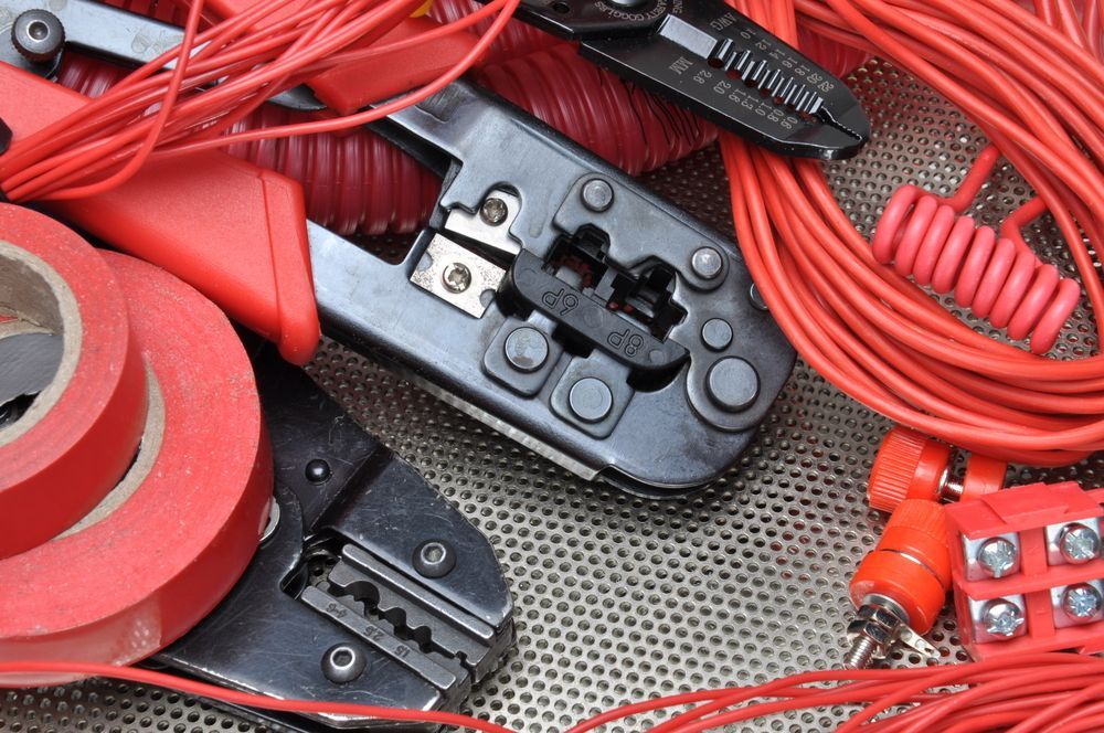 A Bunch Of Red Wires And Tools On A Metal Surface — Summerland Tool Supplies In Casino, NSW