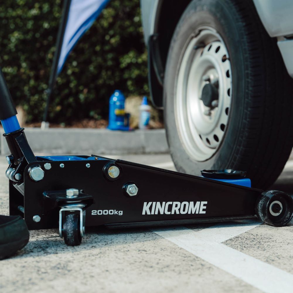 A Kincrome Floor Jack is Sitting Next to a Car— Summerland Tool Supplies in Casino, NSW