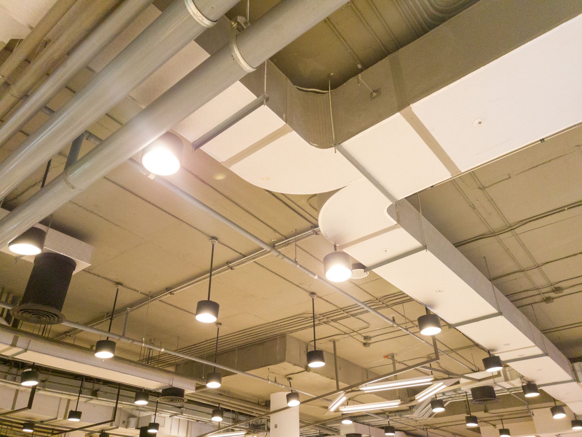 Department store interior highlighting efficient commercial lighting installations.