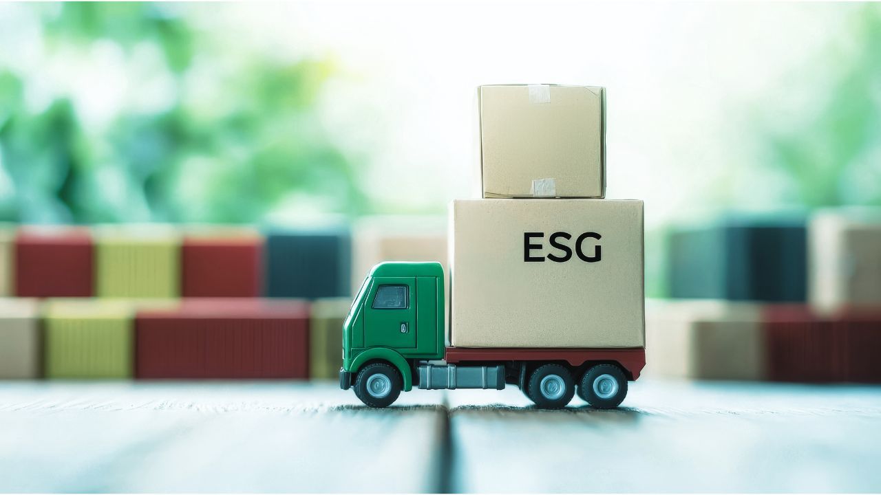 A toy truck is carrying boxes on a wooden table saying ESG in supply chain.