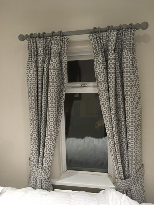 Pencil pleat geometric curtains with grey pole