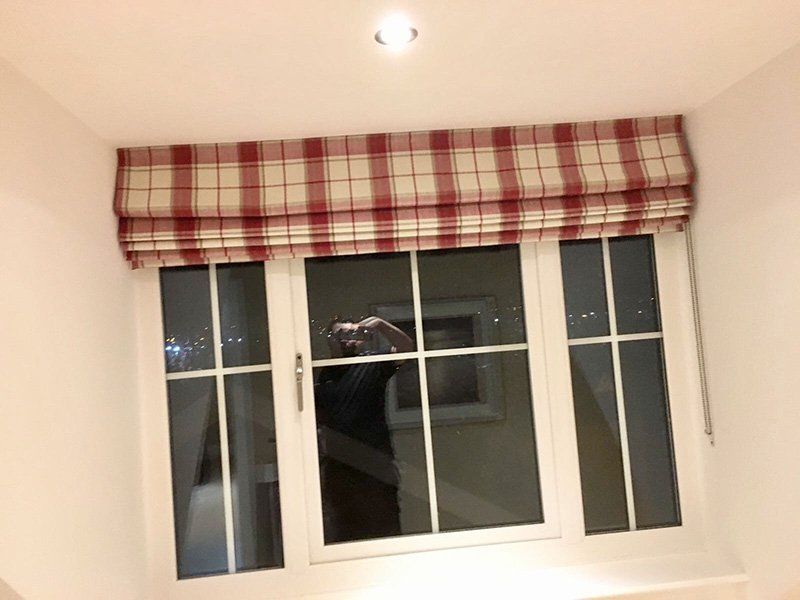 Checked roman blind interlined