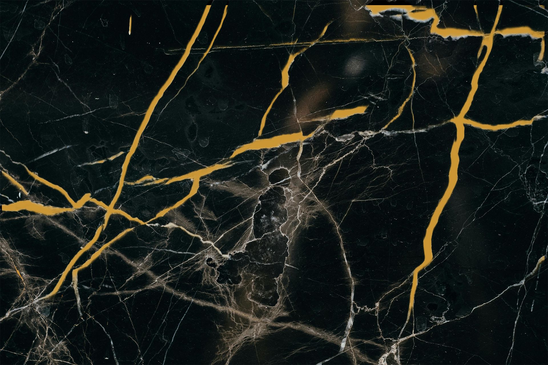 Bright white kitchen with island, stainless steel appliances, and wood flooring.