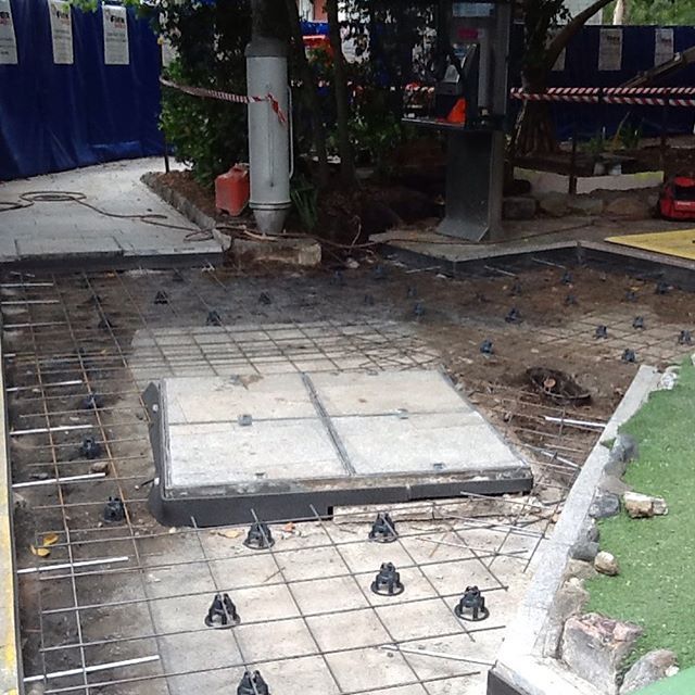 A construction site with a concrete slab in the middle