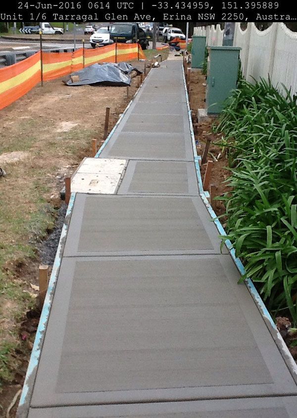 A concrete walkway is being built on june 24 2016