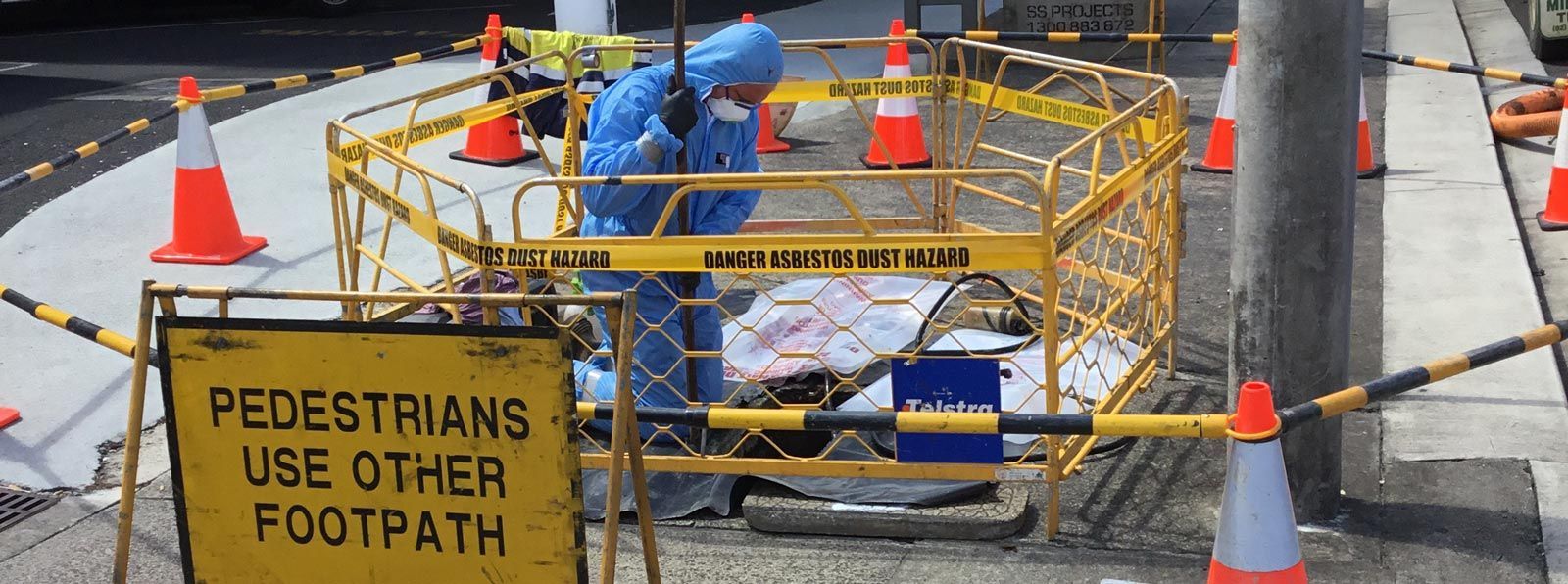 A yellow sign that says pedestrians use other footpath