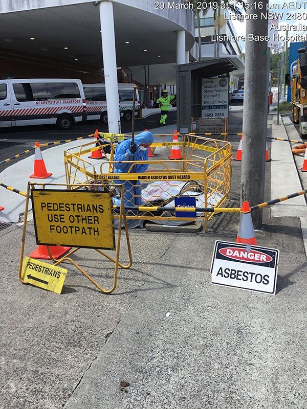 A sign on the sidewalk says pedestrians use other footpath