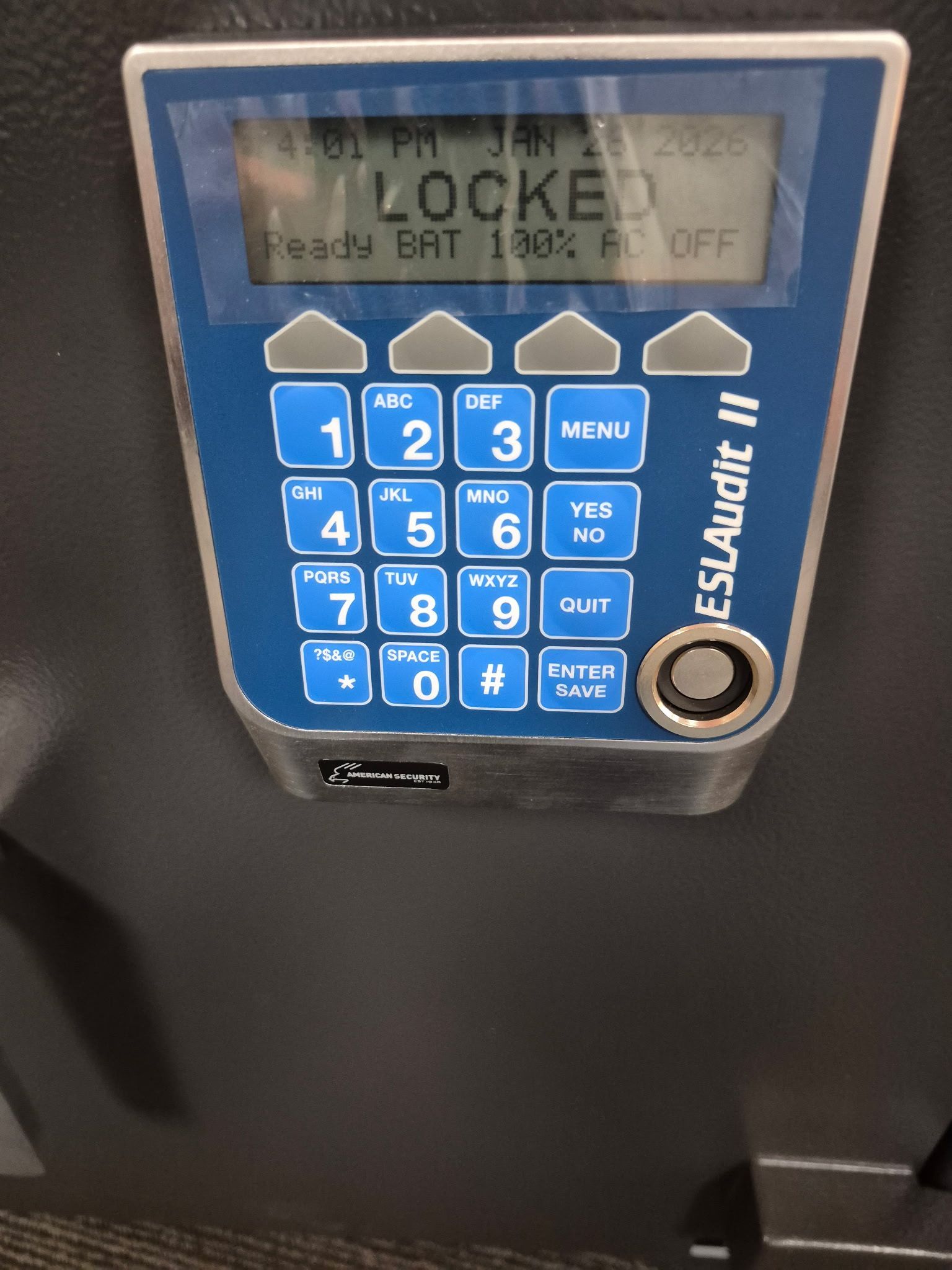 Blue coin-operated public charger kiosk with keypad and display reading “LOCKED”