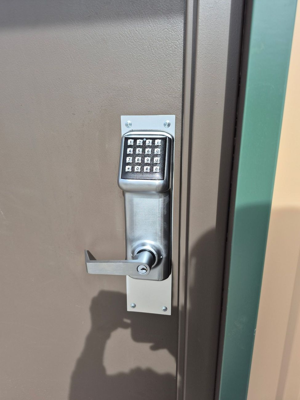 Commercial building entrance with keypad lock system