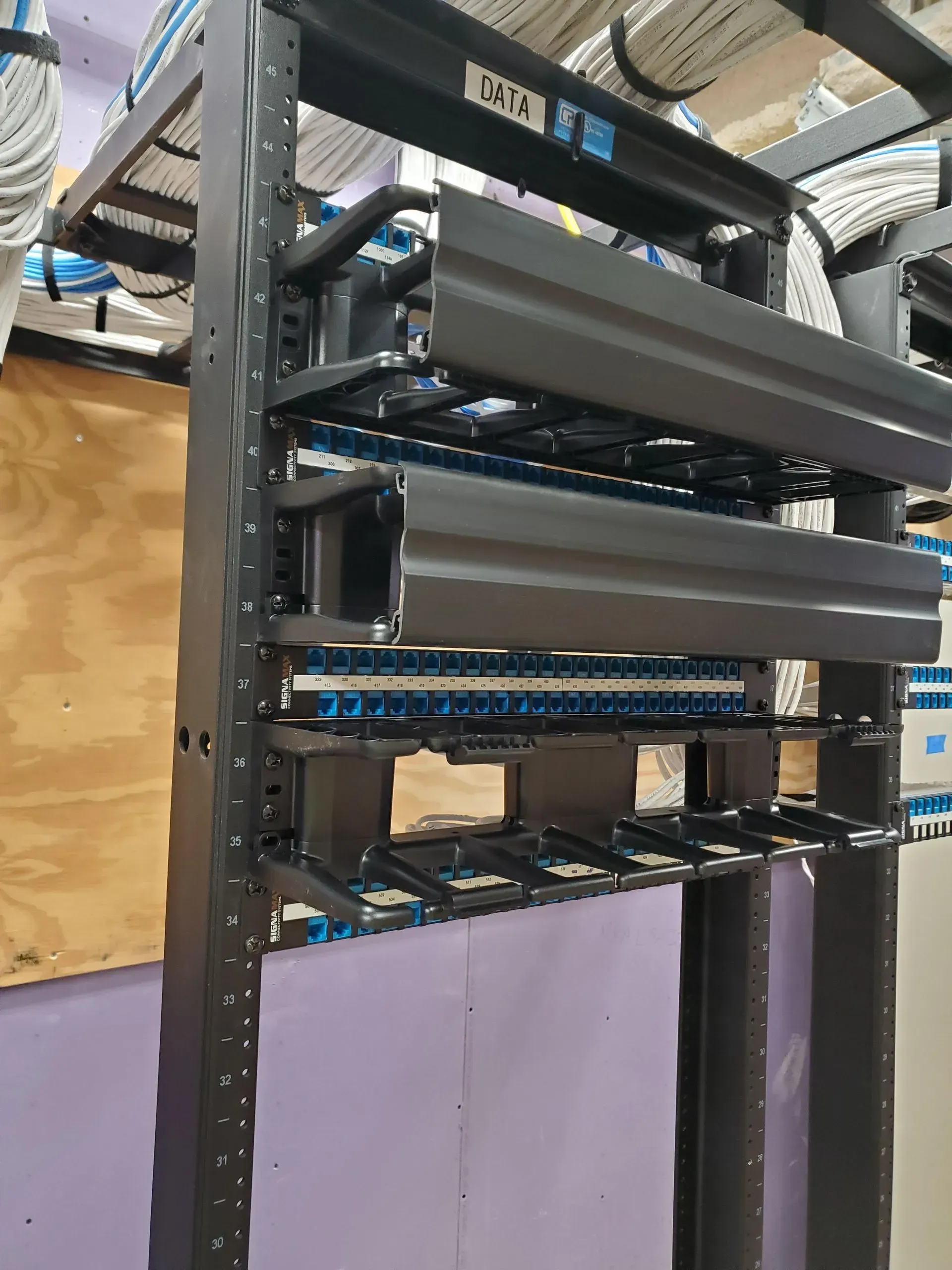 A server rack with a lot of wires on it