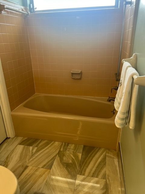 A bathroom with a bathtub before