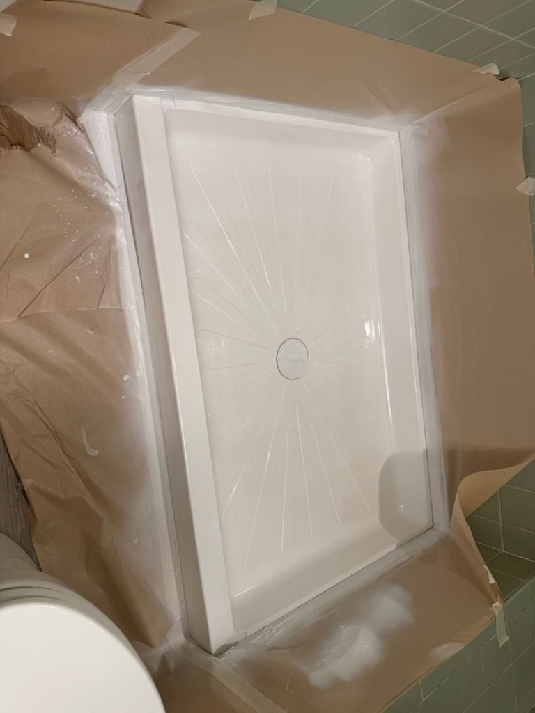 Bathtub in the bathroom with white tiles