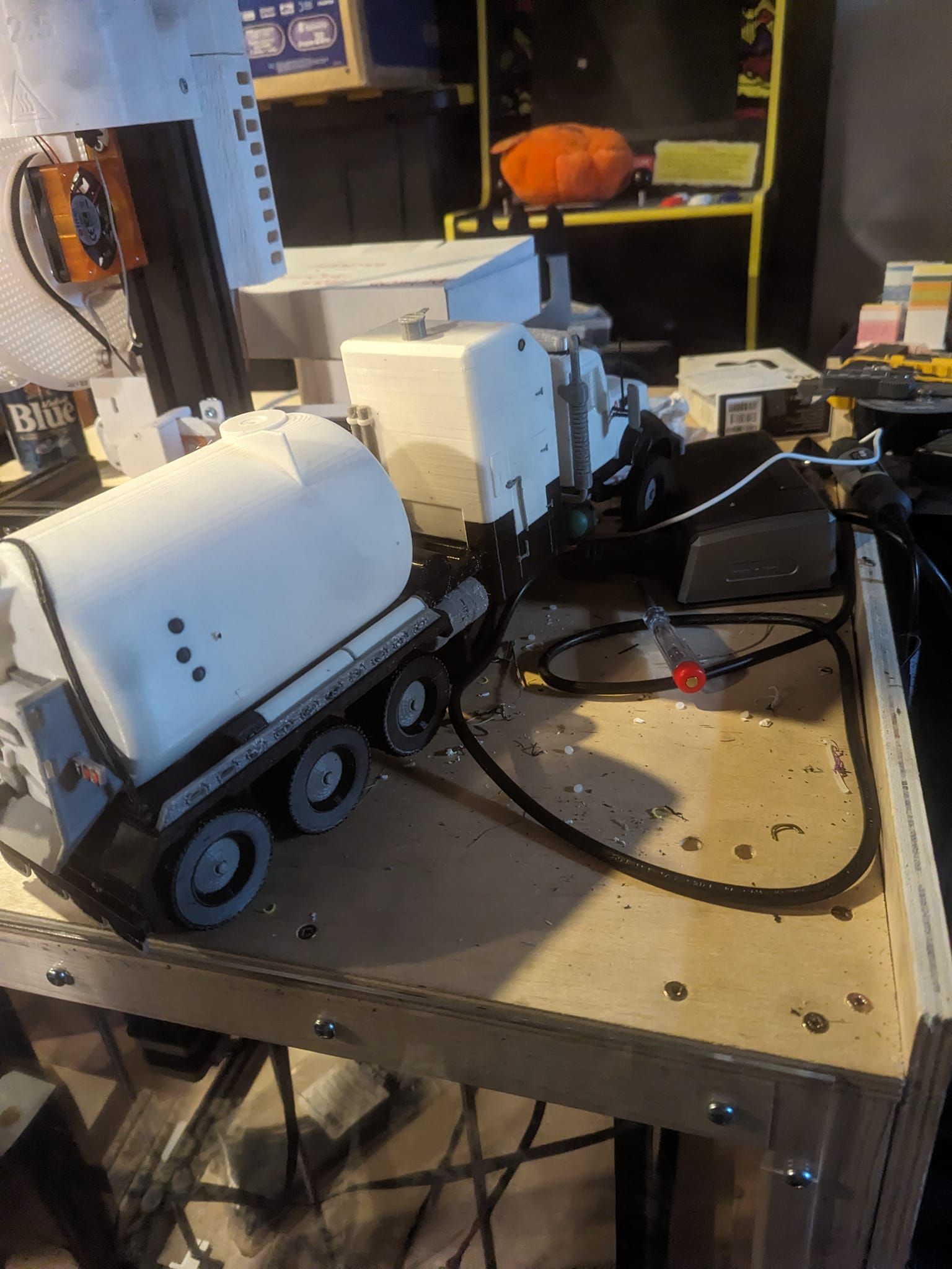 A toy truck is sitting on a wooden table