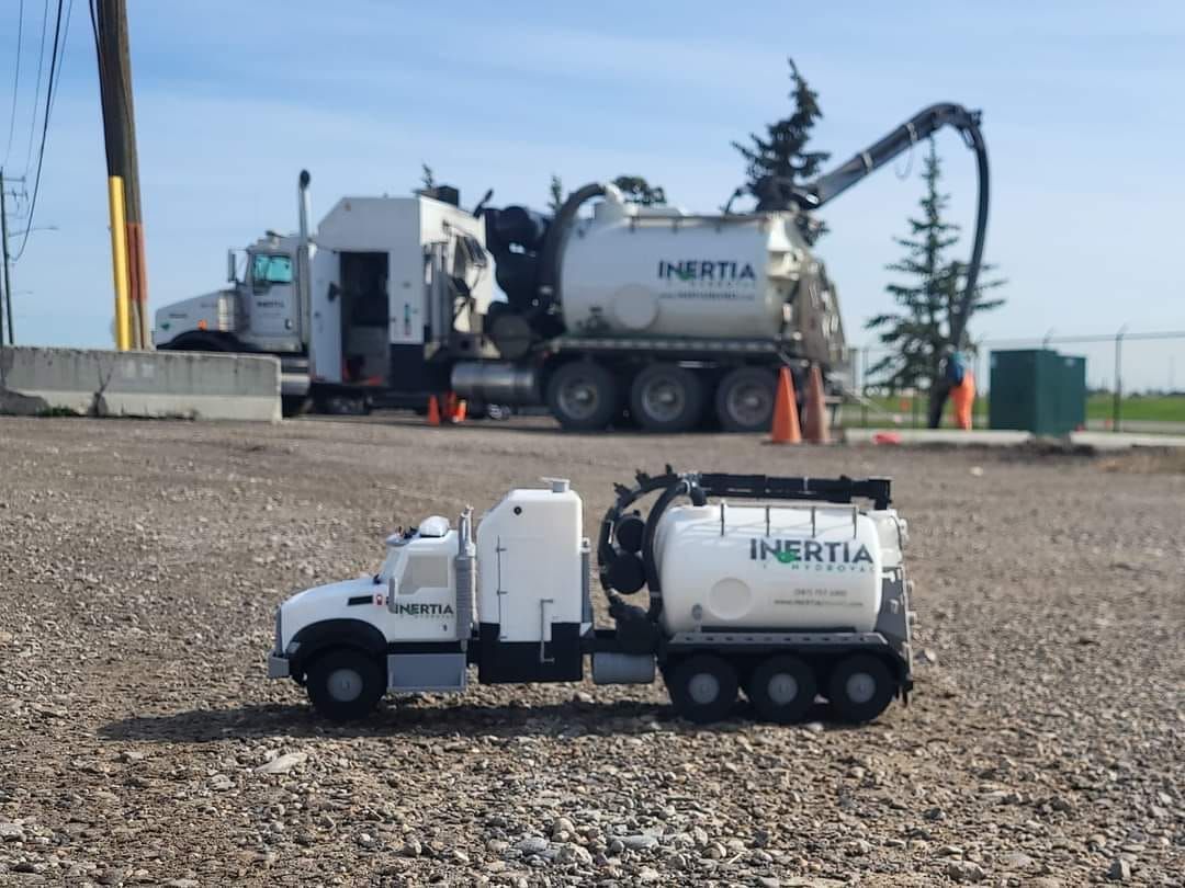 A toy truck with the word inertia on it