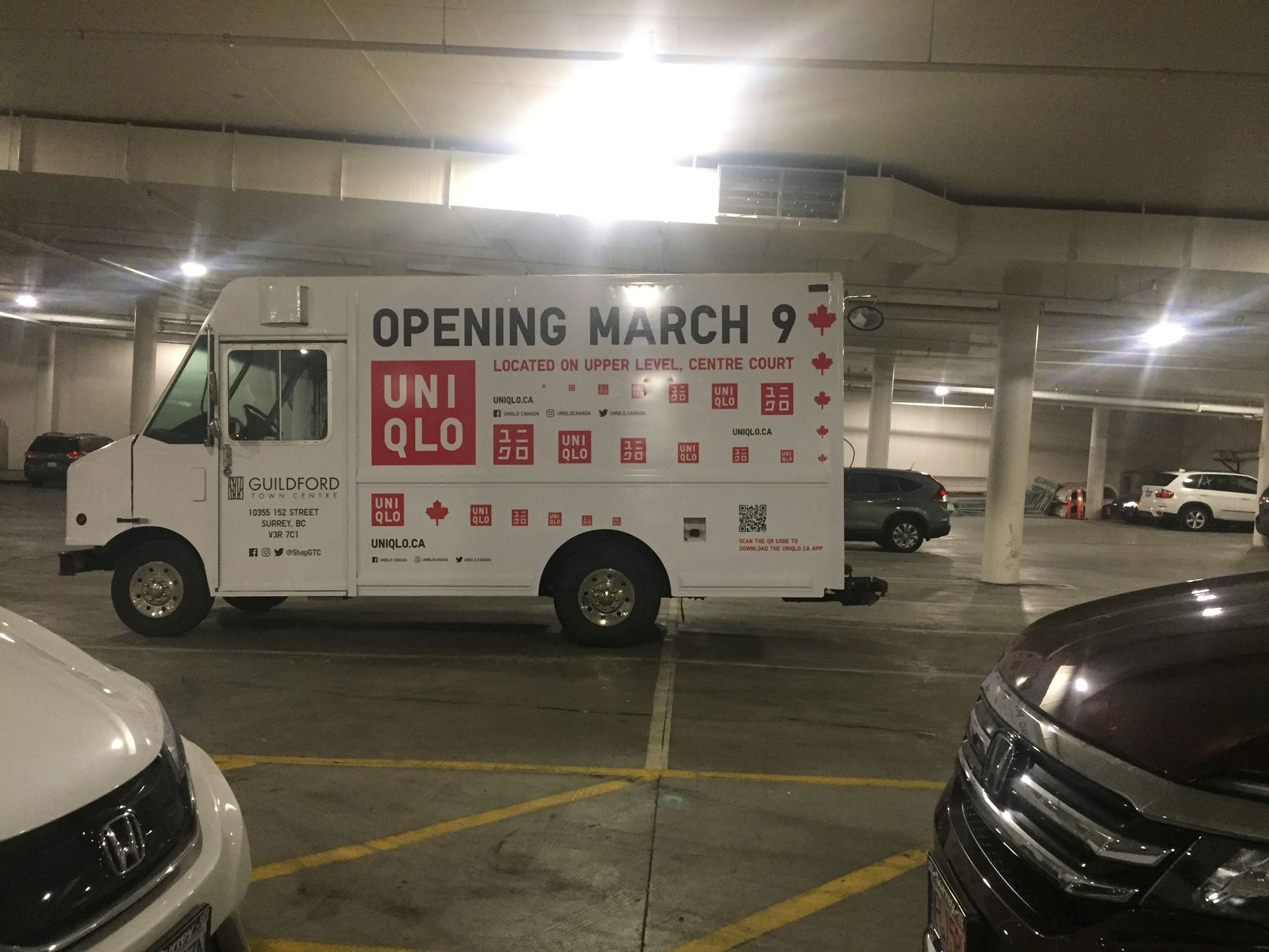 A white truck with the words opening march 9 on it