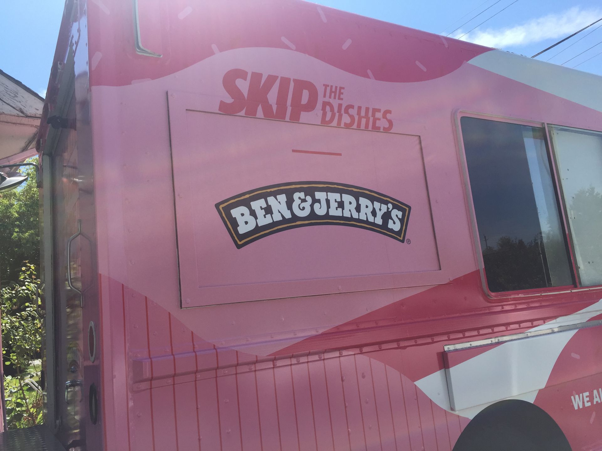 A pink and white ben & jerry 's food truck