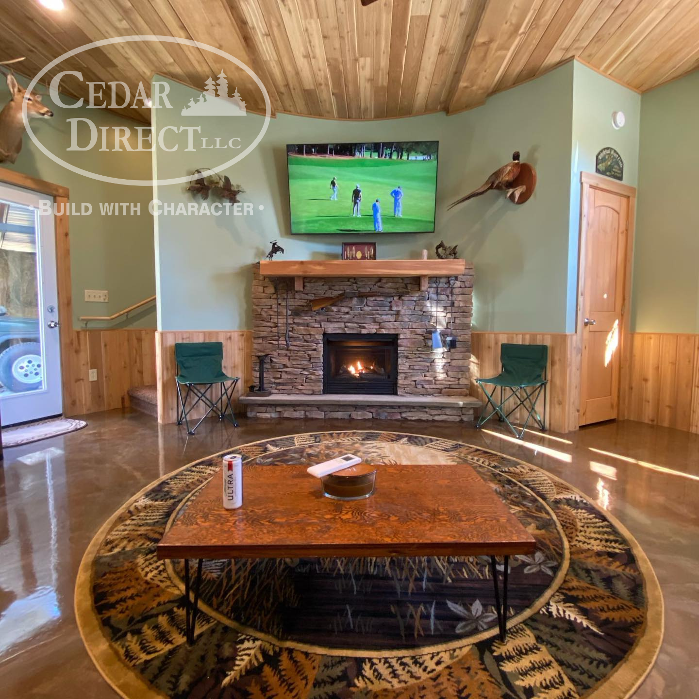 A living room with a fireplace and a tv from cedar direct llc