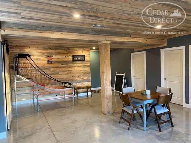 There is a table and chairs in the middle of the room.