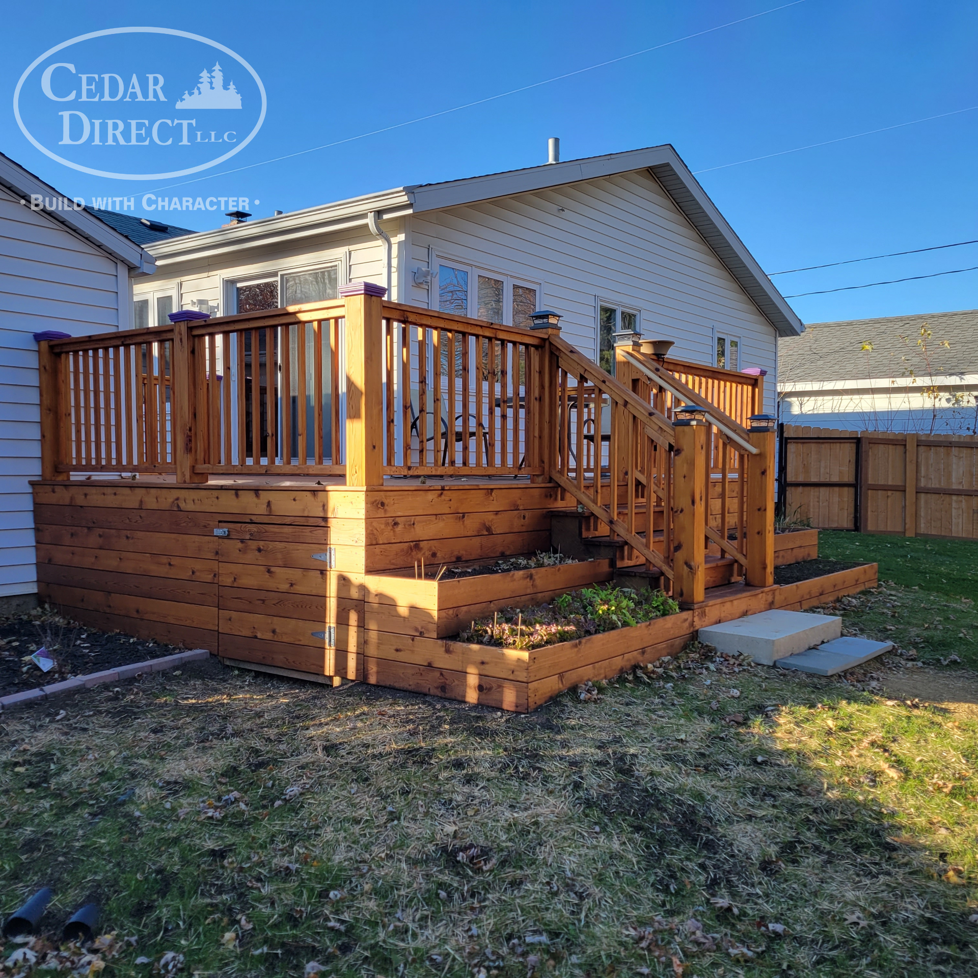A wooden deck with stairs and a sign that says cedar direct