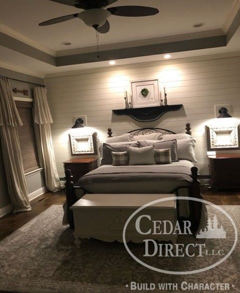 A bedroom with a bed and a ceiling fan by cedar direct llc