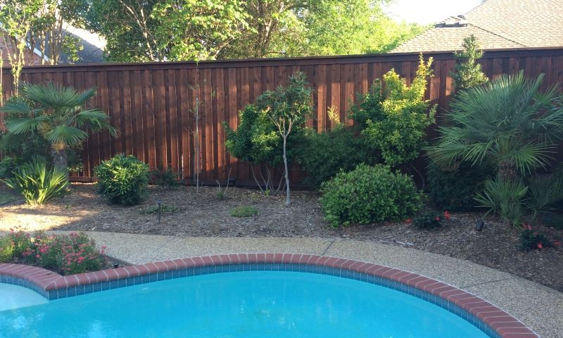 An outdoor wooden fence sealed with Pecan Ready Seal.