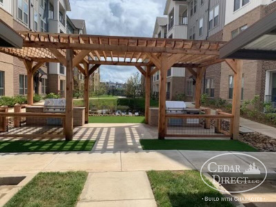 A building with a pergola and a sign that says cedar direct