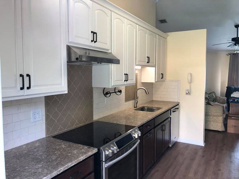 Countertop  and White Cabinet — Orange Park, FL — BLP Renovations & Kingsley Kitchens