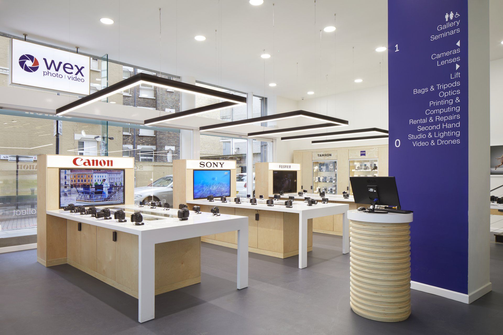 a wide view of product display tables with integral storage