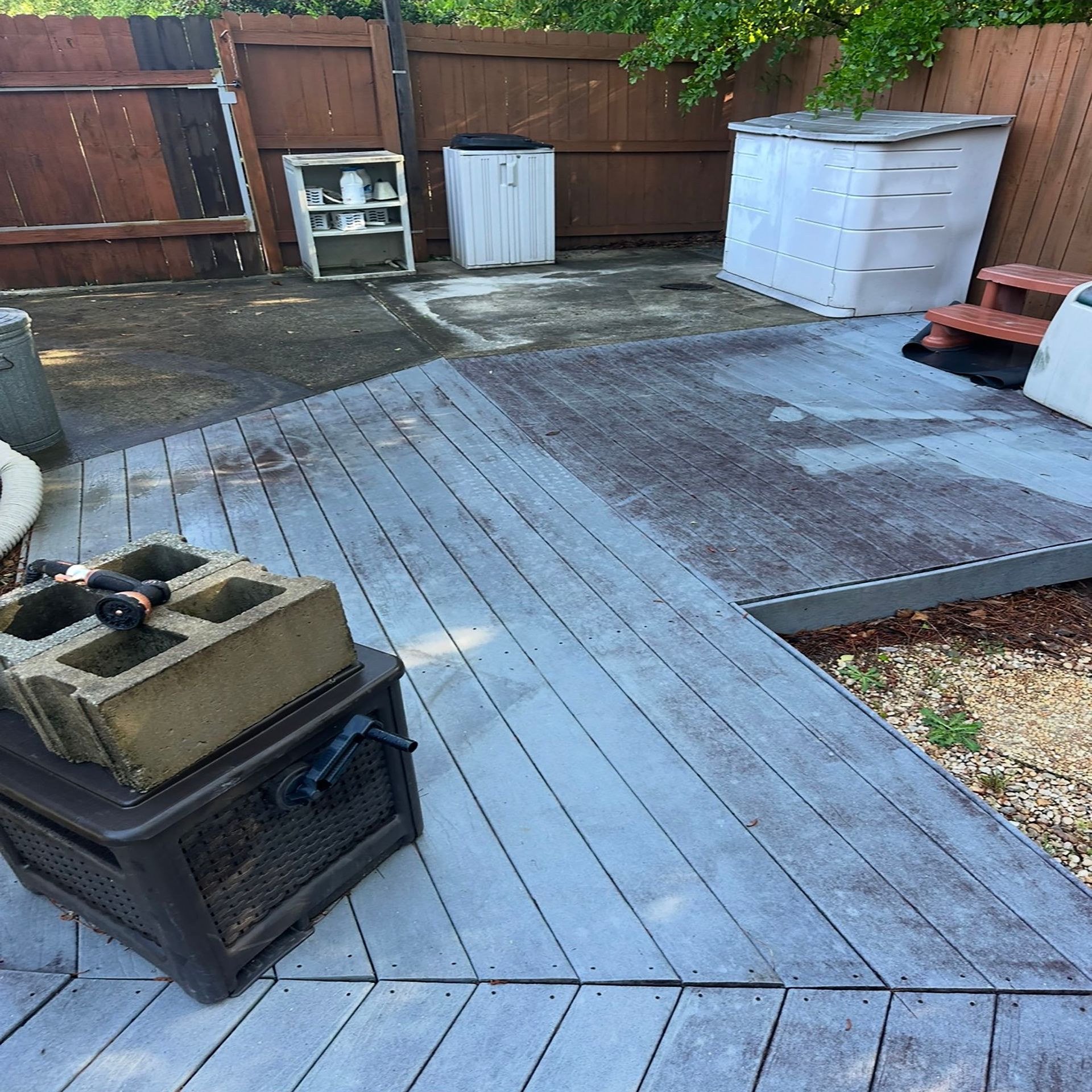 A wooden deck with a stack of concrete blocks on top of it