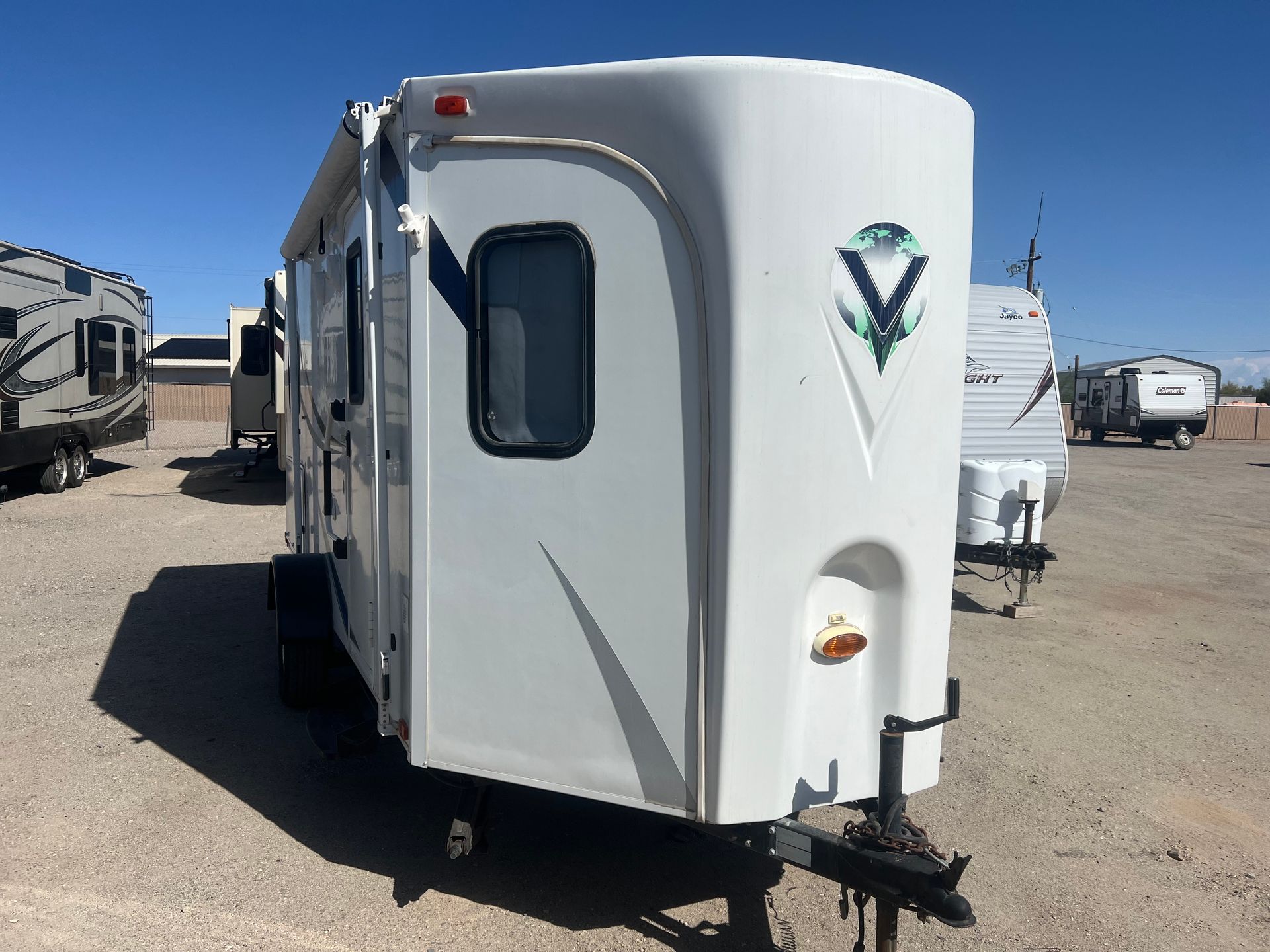 A white flagstaff classic rv is parked in a parking lot