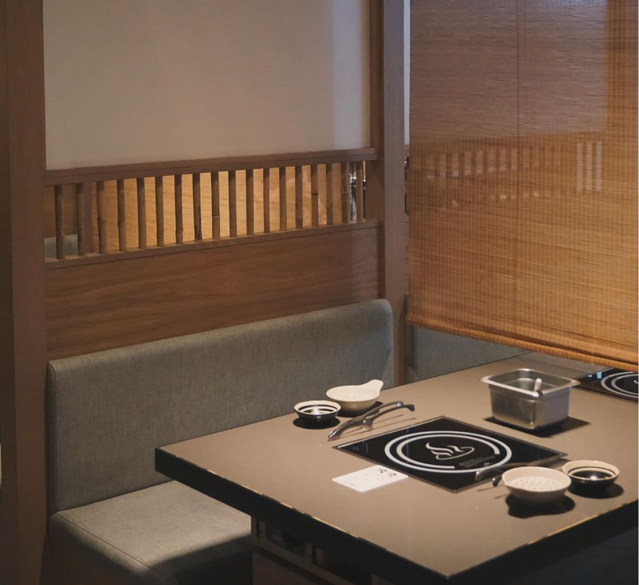 A dining room with a table and a bench