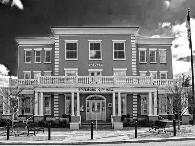 a large building with the word city hall on it