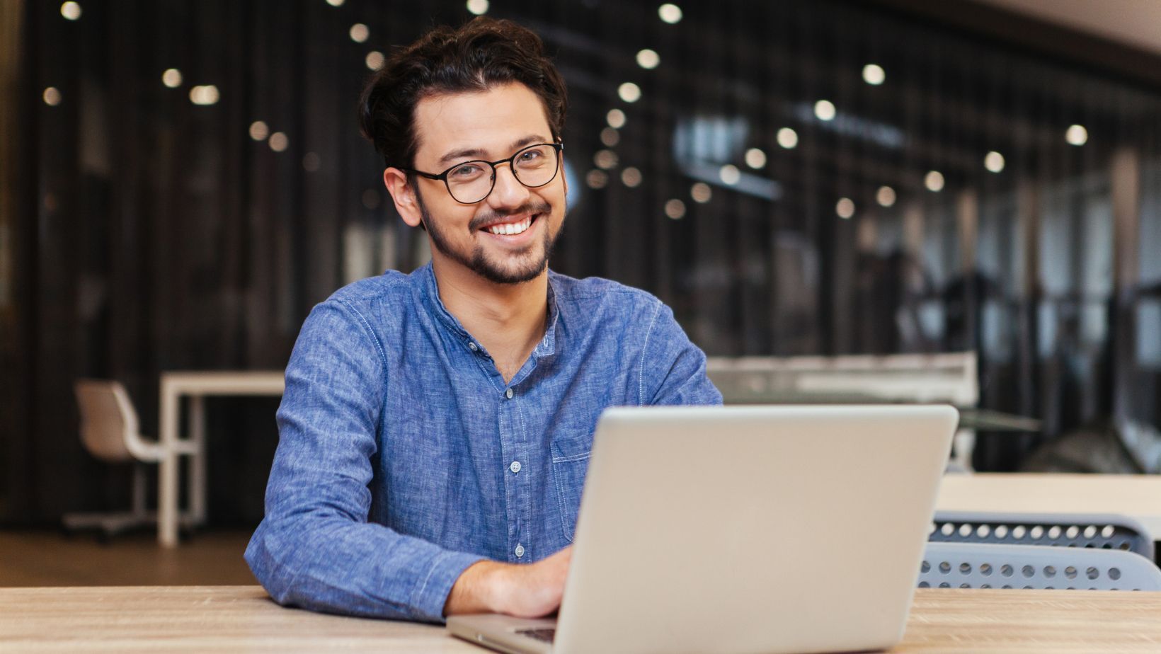 Image of an office worker and a laptop, illustrating the concept of case management setup.