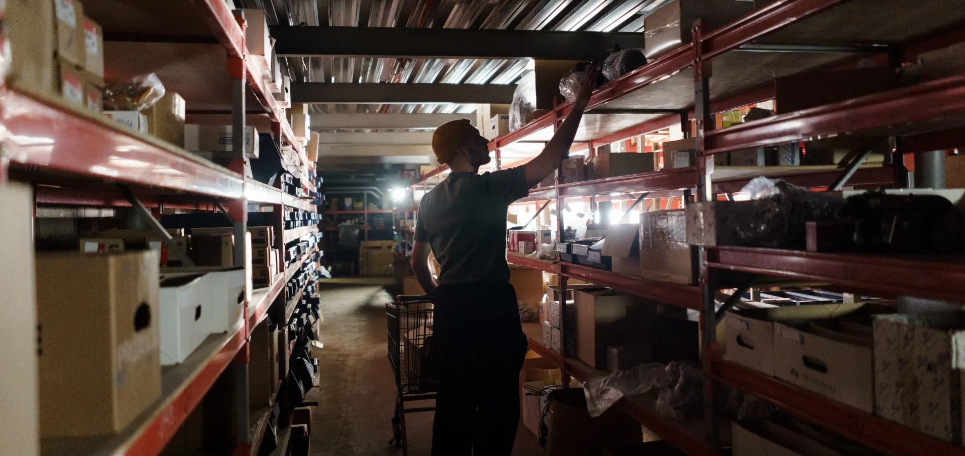 This is an image of a warehouse worker performing a physical inventory count.