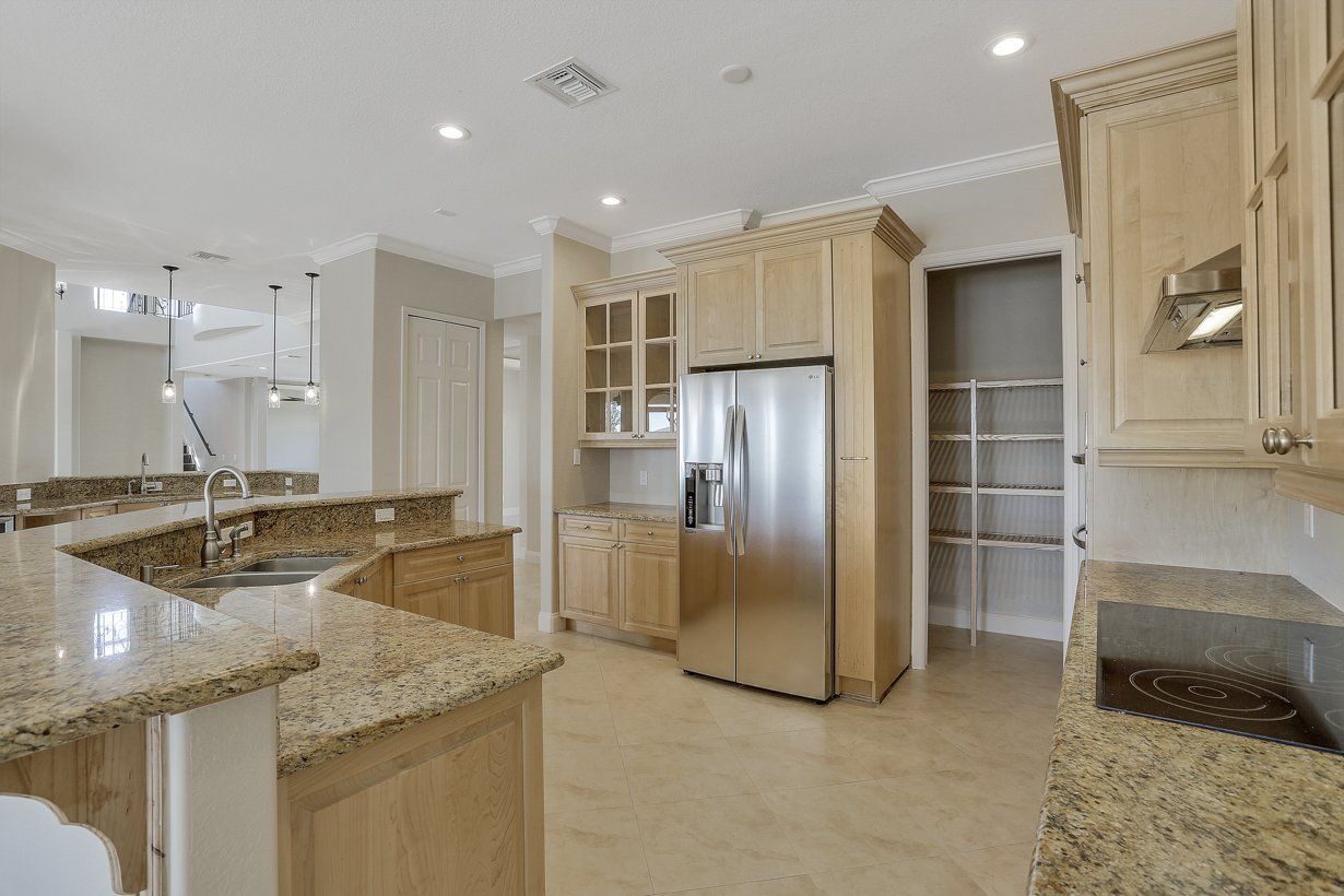 Kitchen with Wooden Cabinets — Fort Myers, FL — Absolute Granite Inc.