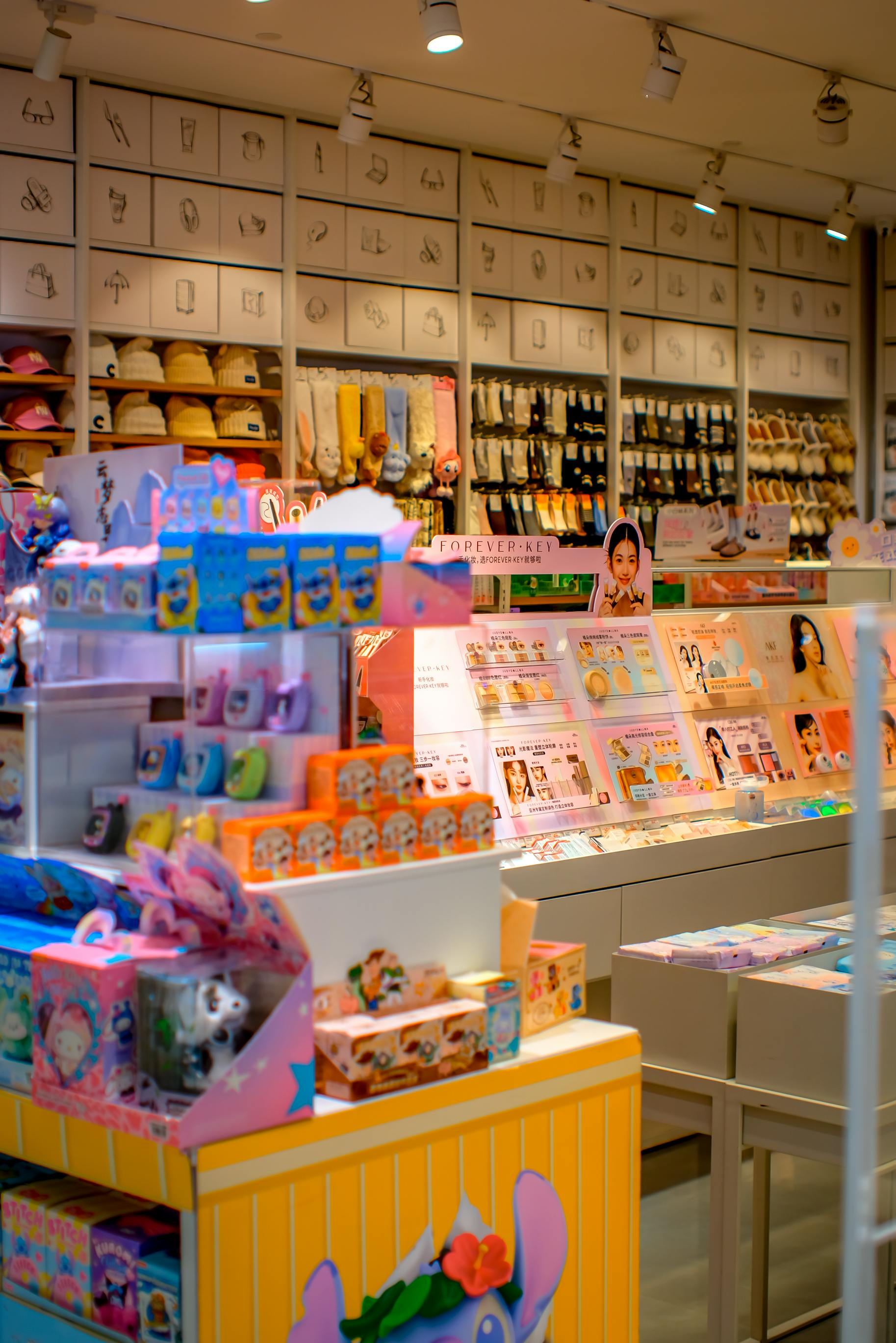 Bright toy and gift shop interior with colorful shelves and hanging lights