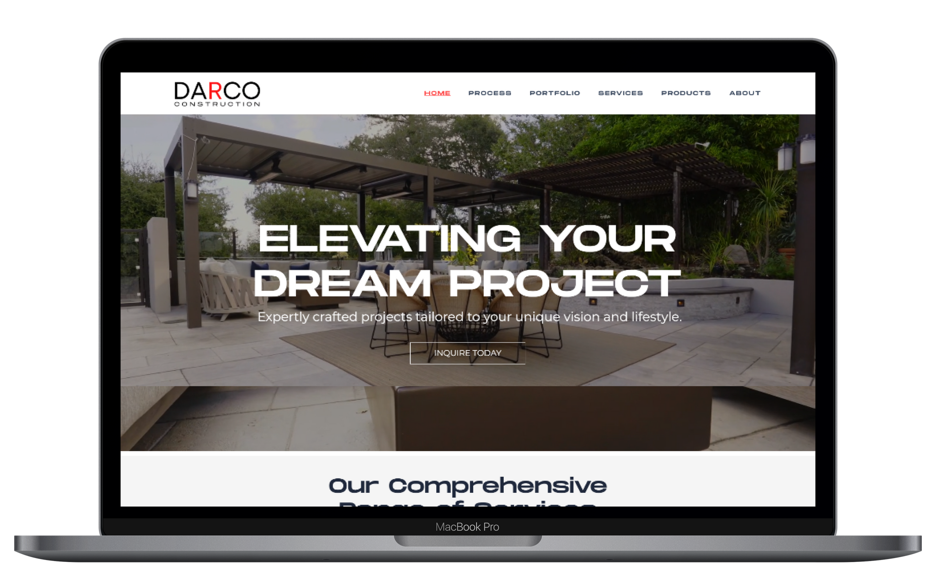 A laptop computer is open to a website that says elevating your dream project.