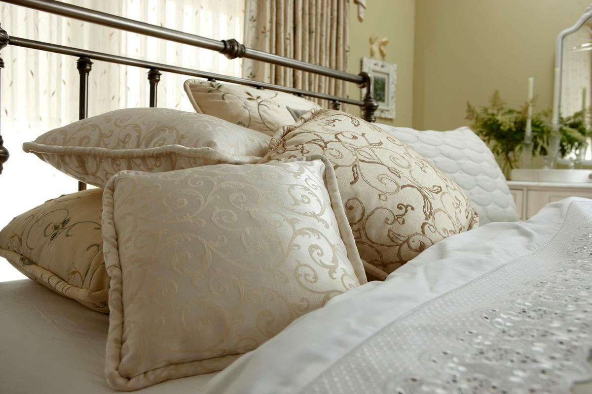 Patterned Pillows and White Bedding