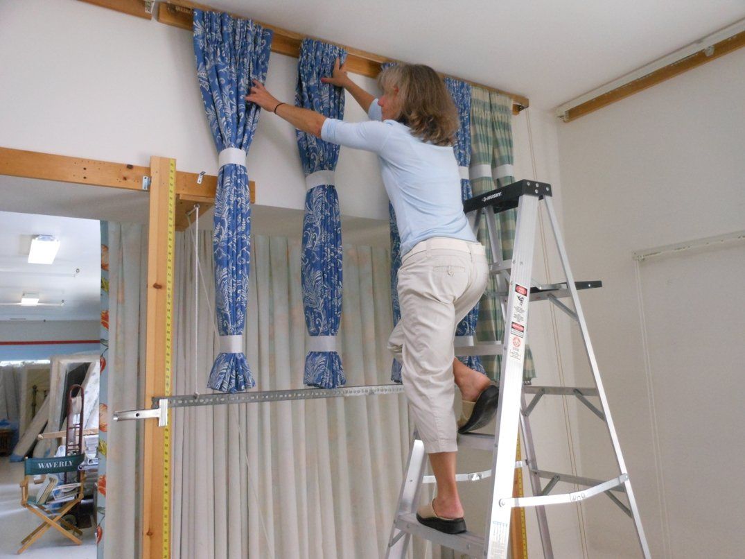 Local Shop Owner Creating Blue Window Treatments