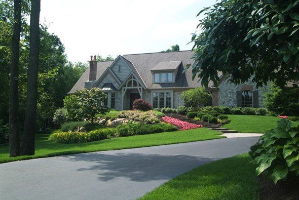 Nice house with nice garden in front — Clarkston, MI — Lowries Landscape Inc