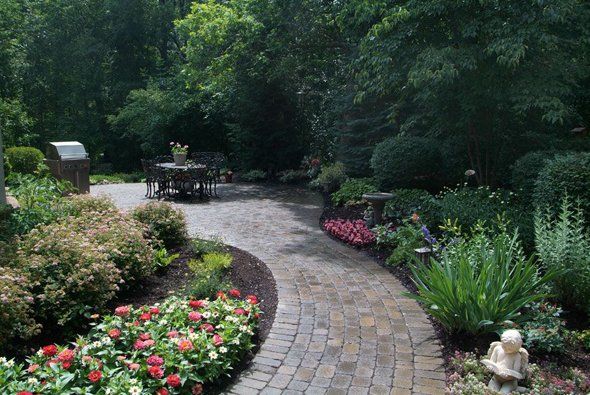 Nice stone steps next to red plants — Clarkston, MI — Lowries Landscape Inc