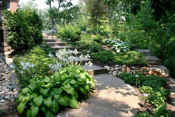 Stairs with a lot of plants on its side — Clarkston, MI — Lowries Landscape Inc