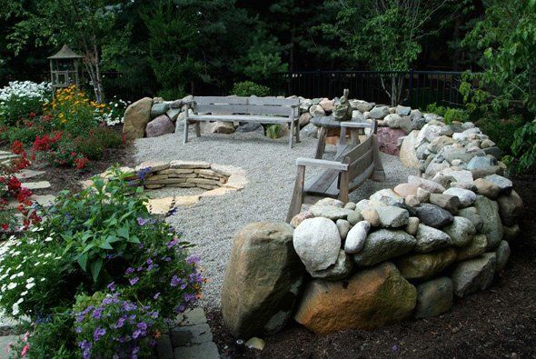 Benches around stone wall — Clarkston, MI — Lowries Landscape Inc